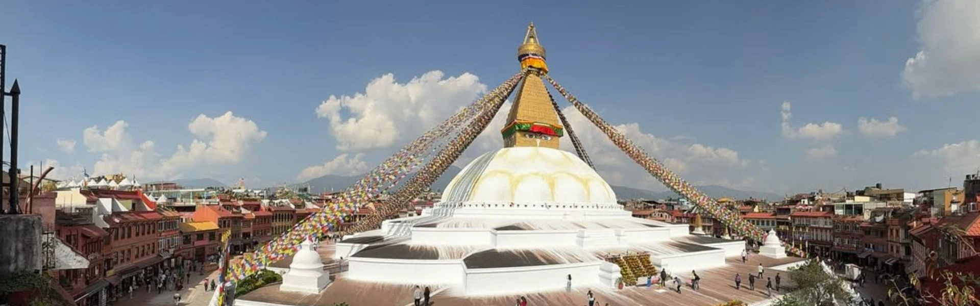 Close-up of the wisdom eyes and golden spire of Boudhanath Stupa in Kathmandu, Nepal.